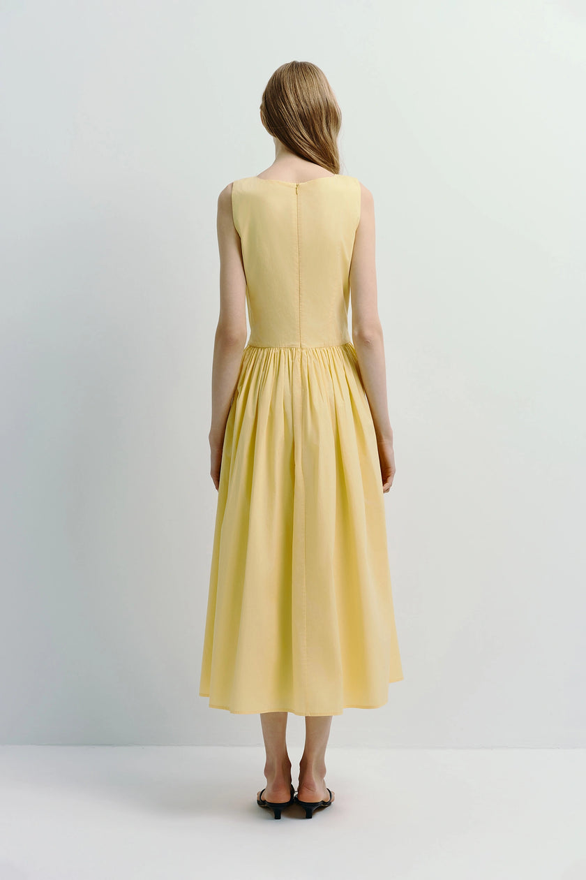 Back view of yellow Luiza Button Front Dress, A-line silhouette, linen-cotton-lyocell blend, with a back zipper.
