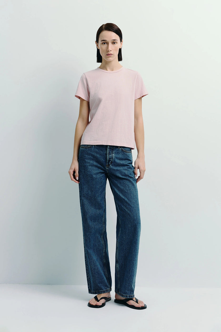 Soft pink Fay Crew Neck Tee, paired with denim jeans. Sustainable cotton tee for everyday style.