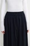 Close-up of the Rue Sophie Panier Drawstring Waist Pleated Skirt in Navy, highlighting the elasticated waistband, drawstring tie, and gathered detailing.