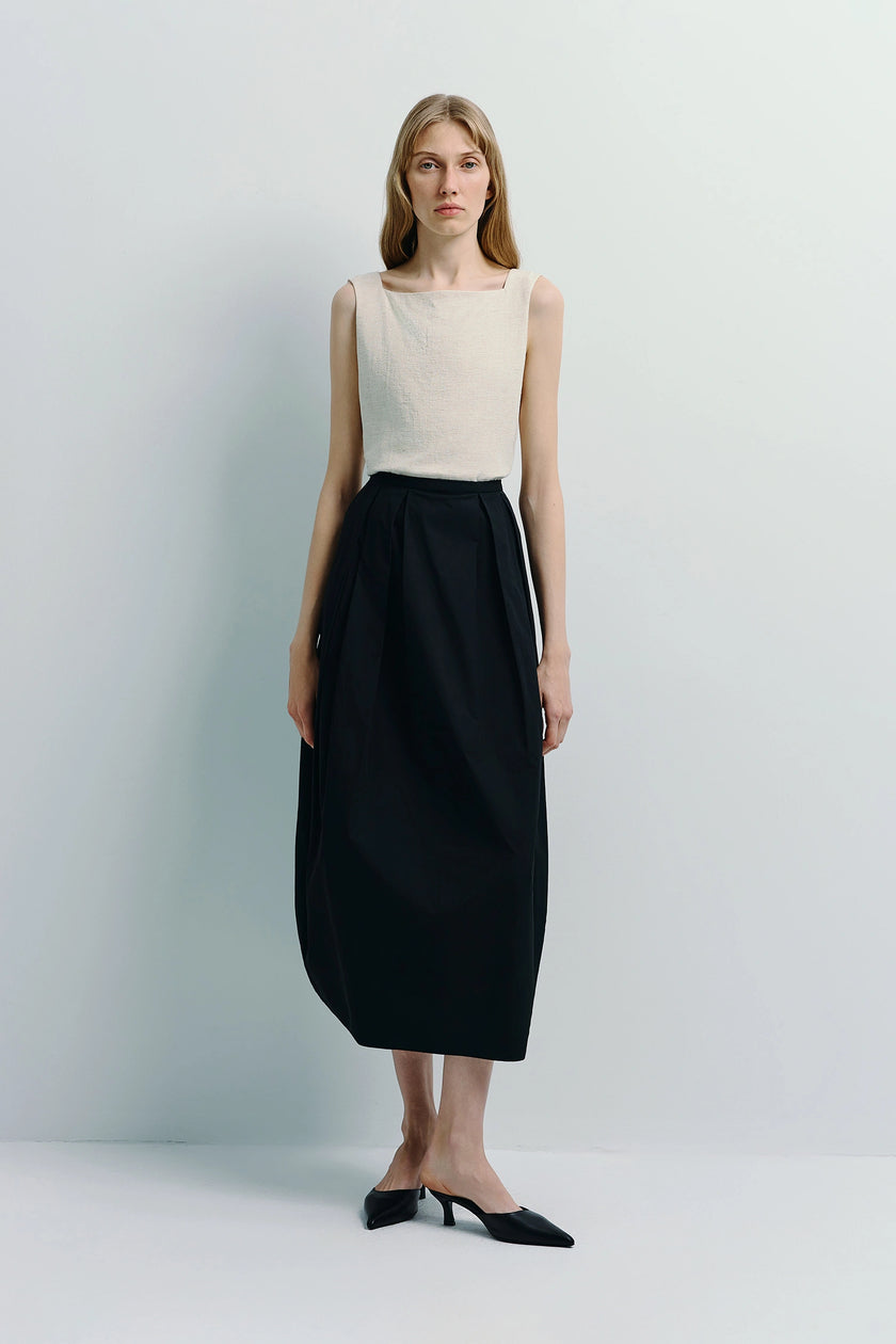 Rue Sophie Ballon Heavy Poplin Pleated Skirt, black skirt and beige top, structured cotton poplin
