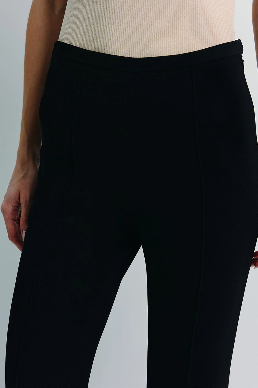 Black Coupe Tapered Leg Slim Pant, close-up showcasing tailored fit and fabric details