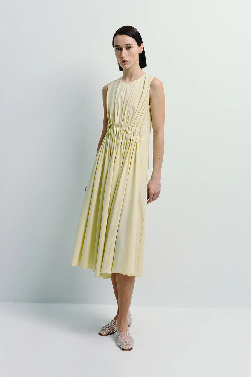 Toulouse Origami Pleat Dress in Pale Yellow, featuring architectural pleats and flowing skirt