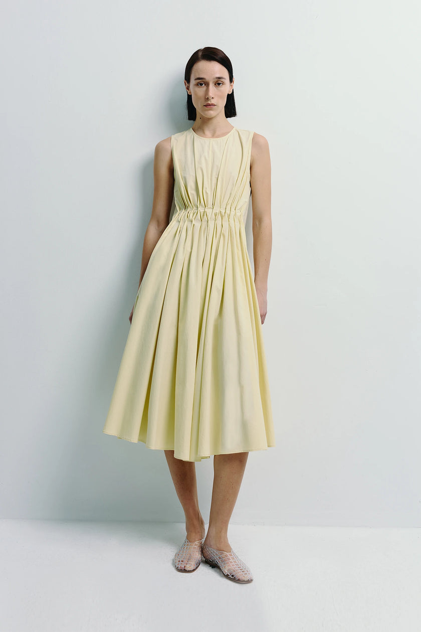 Toulouse Origami Pleat Dress in pale yellow with pleated bodice and flowing skirt, Rue Sophie
