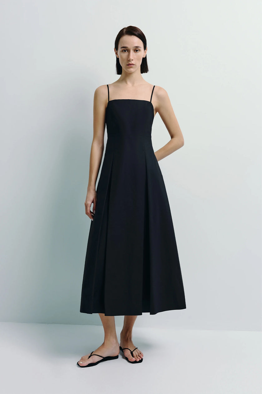 Black Nantes Cami Dress with pleated front and fluid silhouette, crafted from 100% cotton.