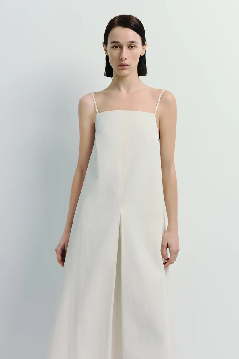 Voile Box Pleat Cami Dress in White. Crafted from 100% cotton, feminine silhouette.