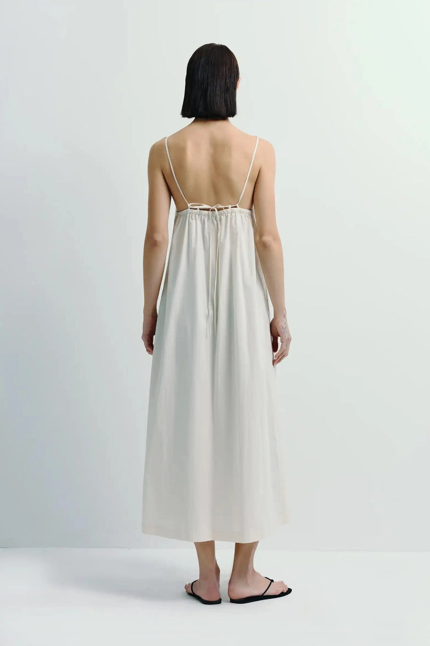 White Voile Box Pleat Cami Dress. 100% cotton cami dress with a crisp box pleat and a square neckline.