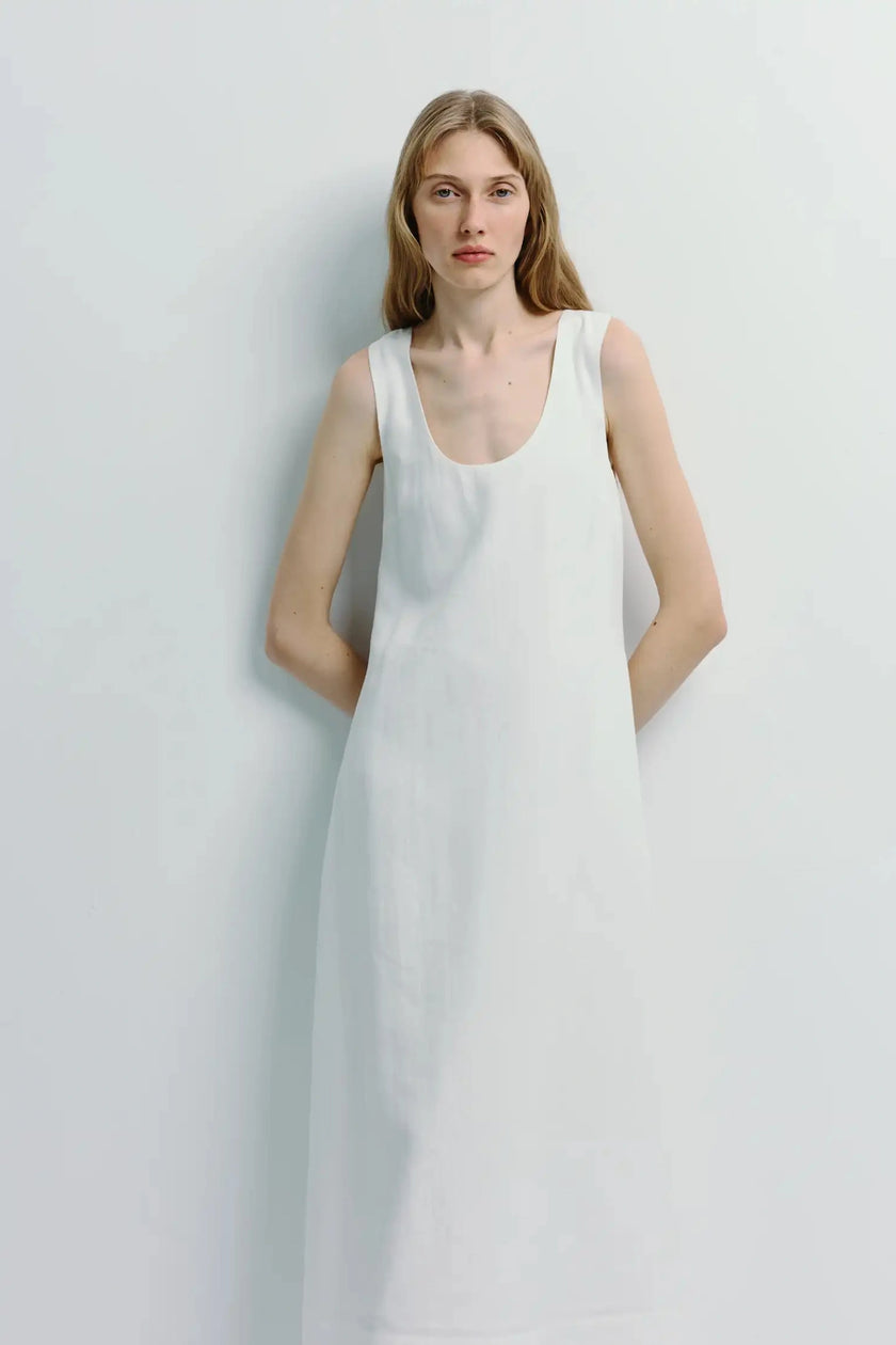 White Adeline Scoop Neck Dress. Sleeveless scoop neck dress with a column silhouette