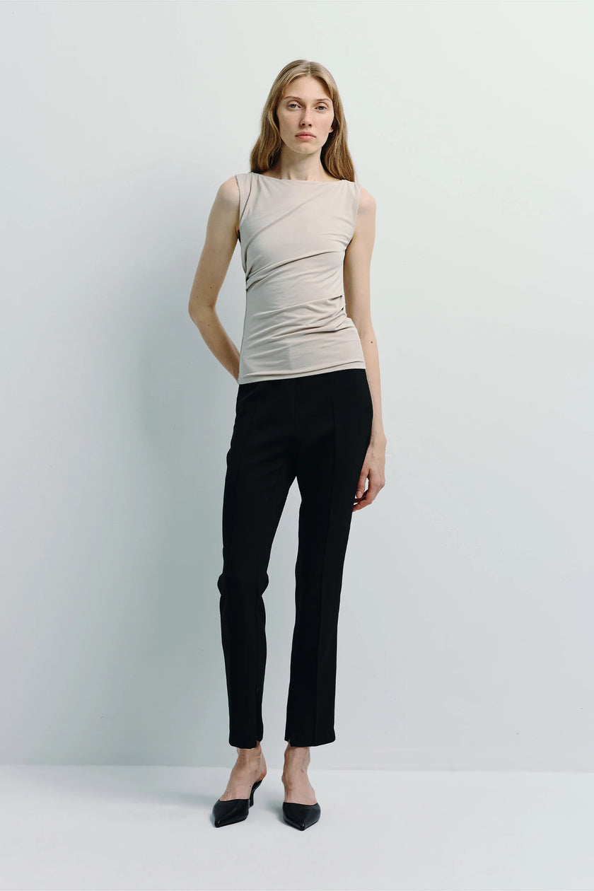 Ruesophie Fantine Top in beige and black tailored pants, showcasing a modern minimalist aesthetic.