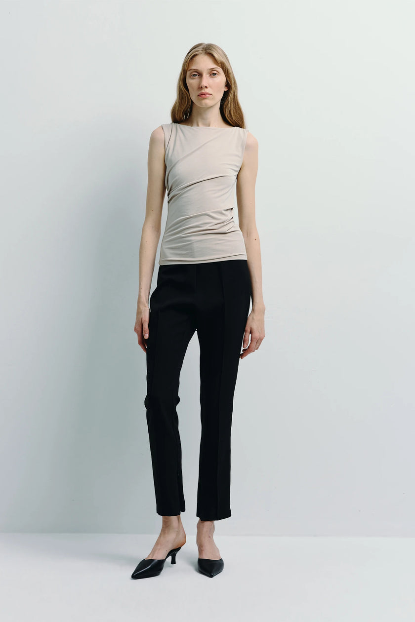 Fantine Side Pleat Top in beige paired with black tailored pants, premium modal blend