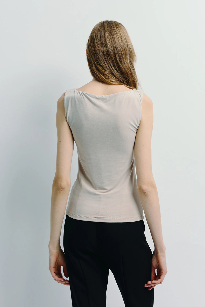 Fantine Top beige back view, premium modal blend, paired with black tailored pants