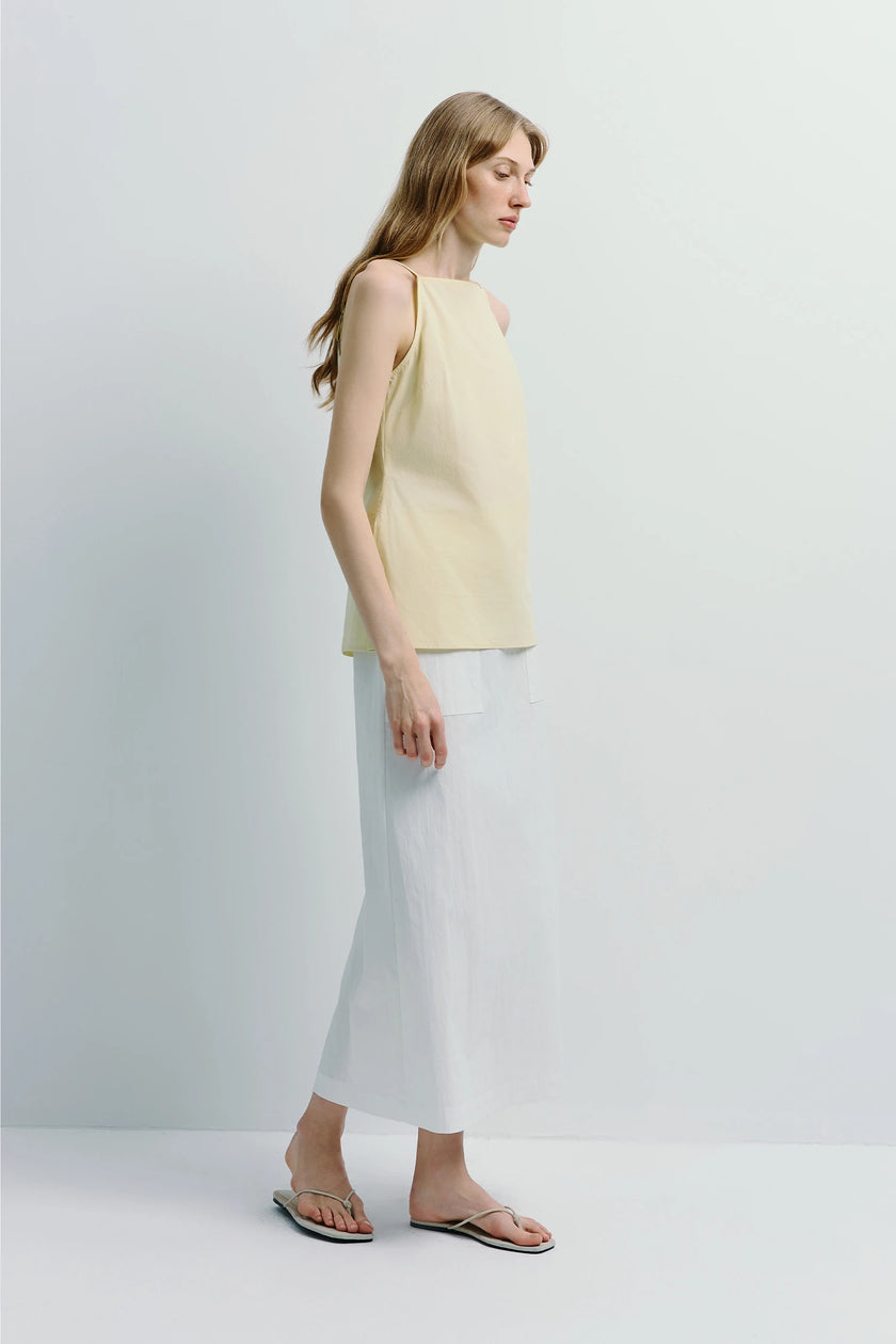 Vélo Square Neck Cami Top in pale yellow, square neckline cotton top, paired with white skirt and sandals, minimalist design