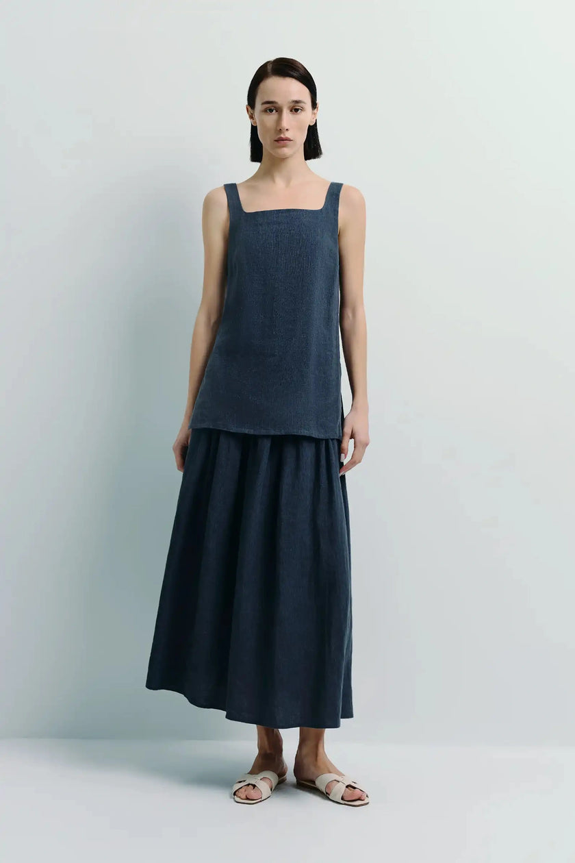 Dark blue linen square neck top and midi skirt set on a woman, minimalist style, soft material