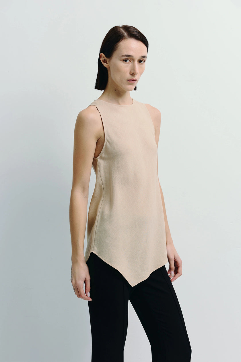 Agmes Handkerchief Hem Top in beige linen-blend twill with asymmetric hem and black trousers, summer wear