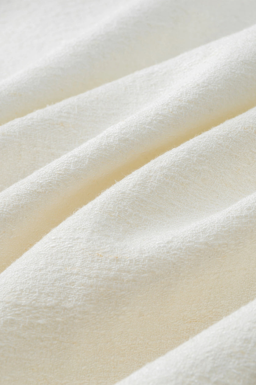 Close-up of white linen-cotton blend fabric, Carré High Square Neck Top material detail