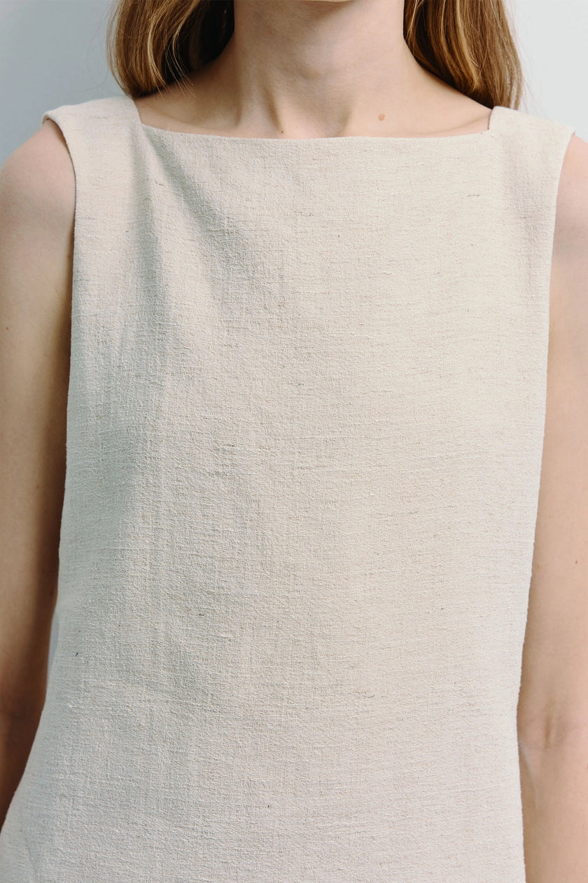 Carré High Square Neck Top in cream linen-blend. Minimalist design with a structured square neckline, showcasing the fabric.