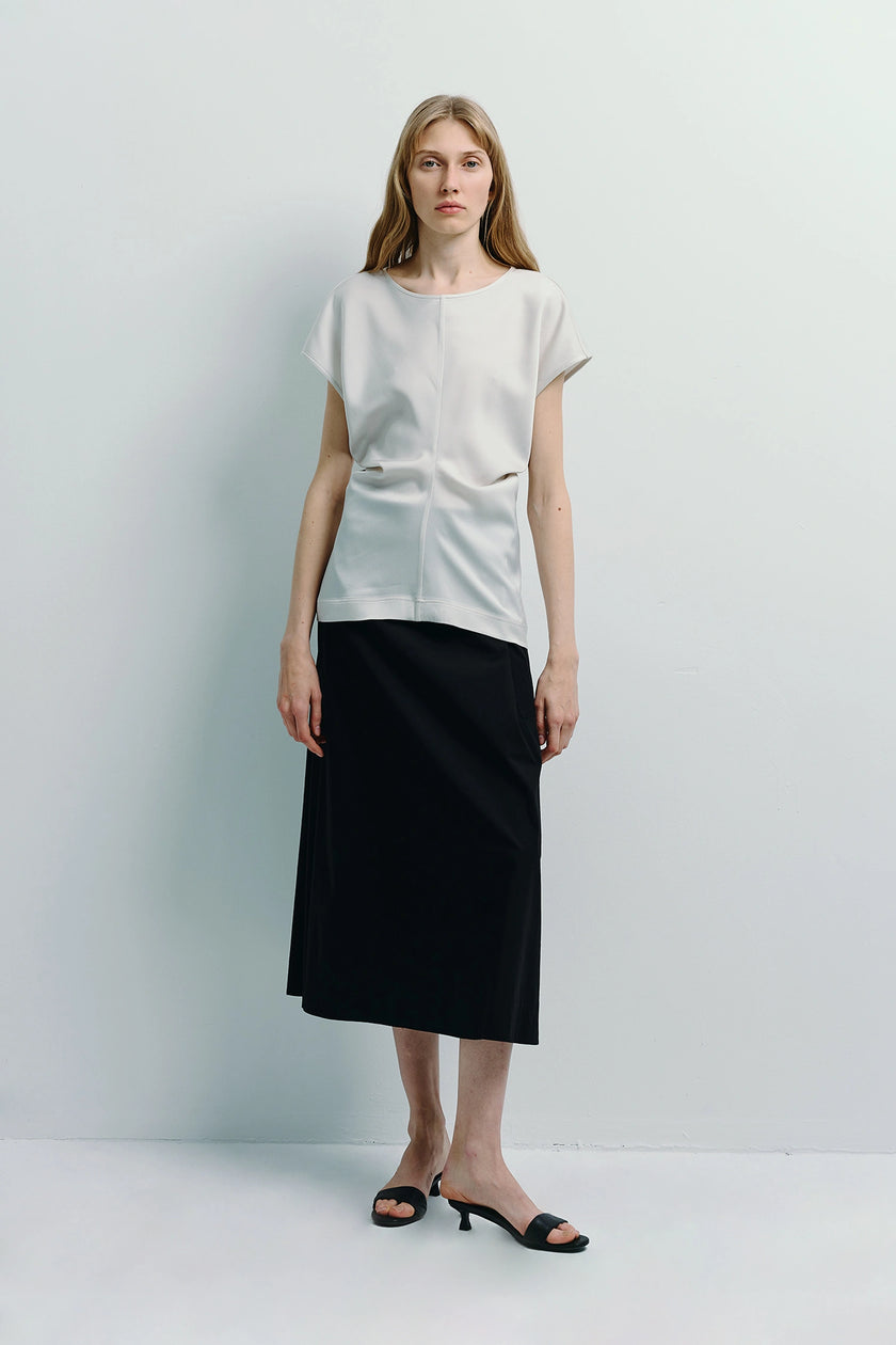 Ivory Bureau Dolman Top with black skirt, featuring dolman sleeves and structured silhouette