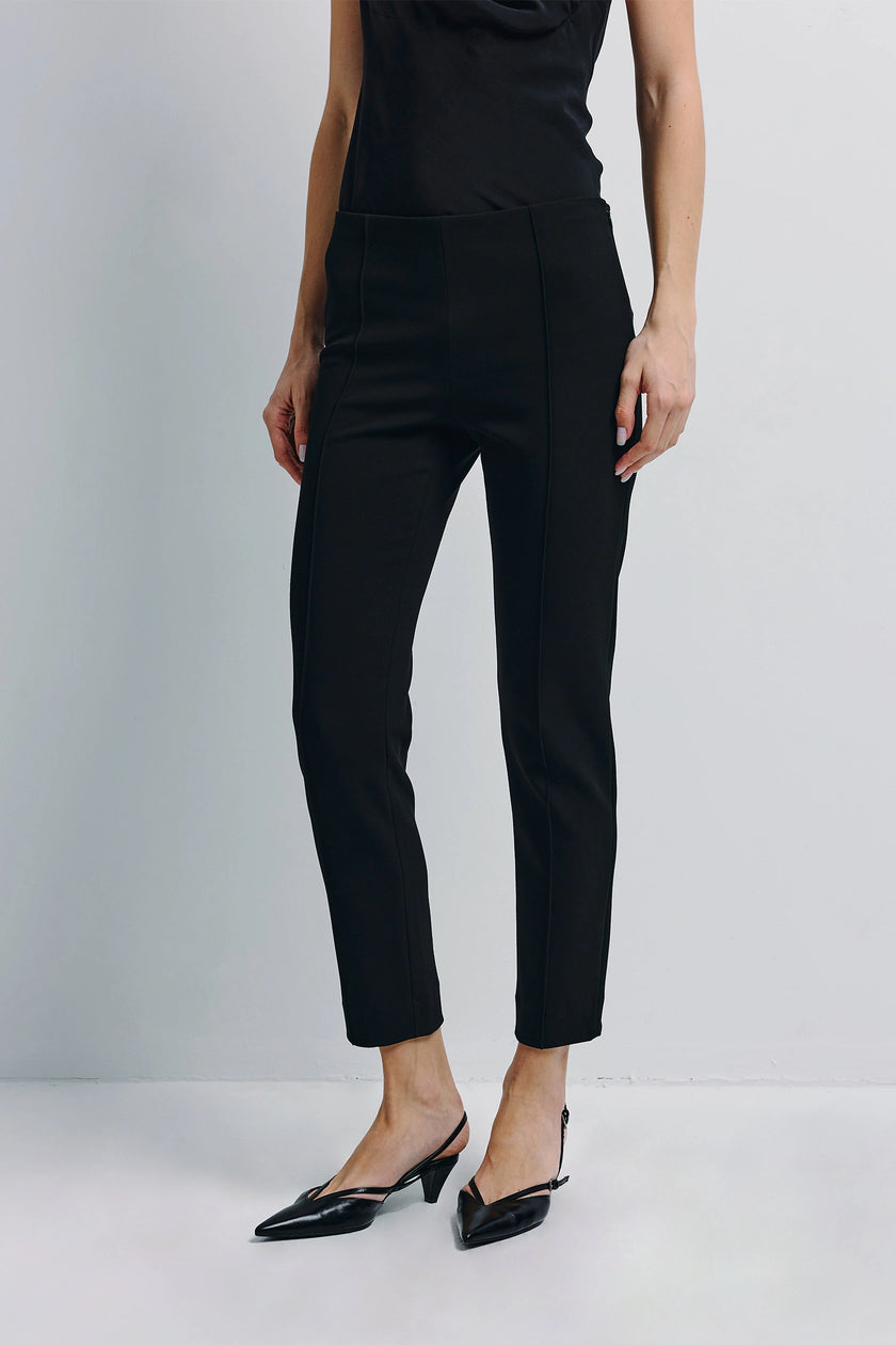 Morris Cropped Slim Pant in Black, styled with a black top and heels, by Rue Sophie