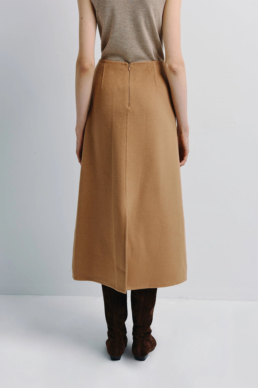 Ambre Pleat Front Midi Skirt in camel wool-cashmere, A-line silhouette, paired with neutral top and suede boots