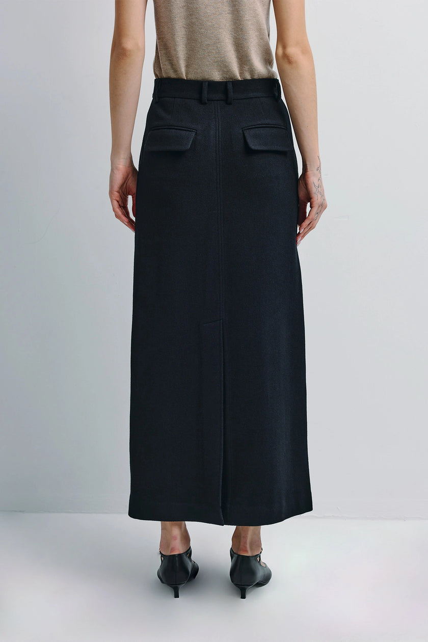 Ruesophie Camberly midi skirt in black wool-cashmere blend, showing back flap pockets.
