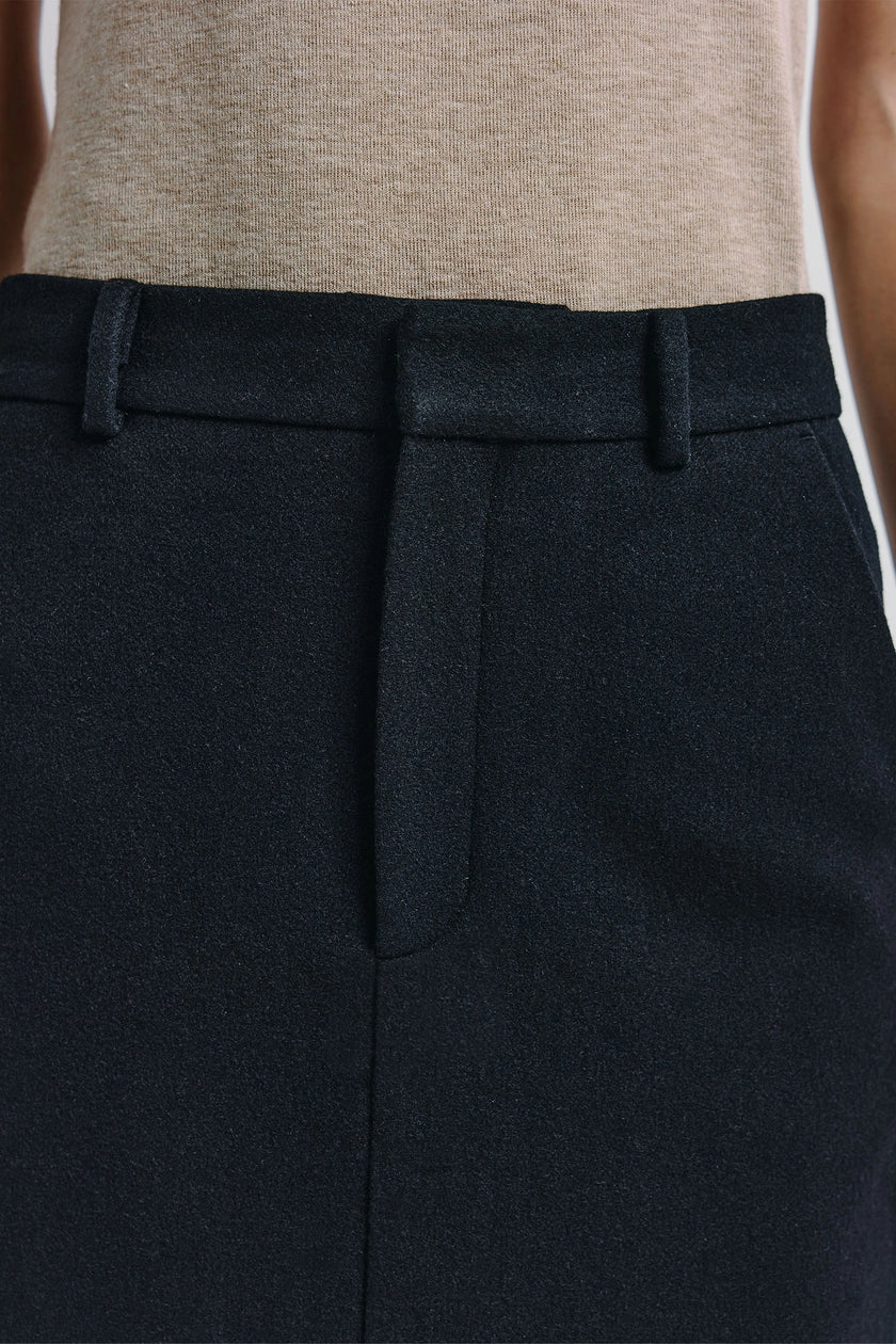 Camberly midi skirt in black wool-cashmere blend with elegant tailoring and hook-and-eye closure.