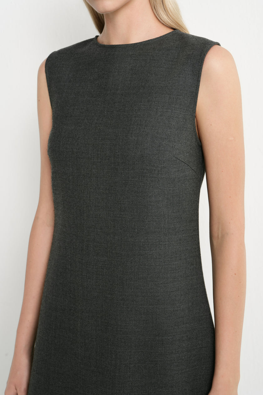 A sleeveless dark charcoal gray knit dress with a crew neckline, shown on a model against a plain light background.