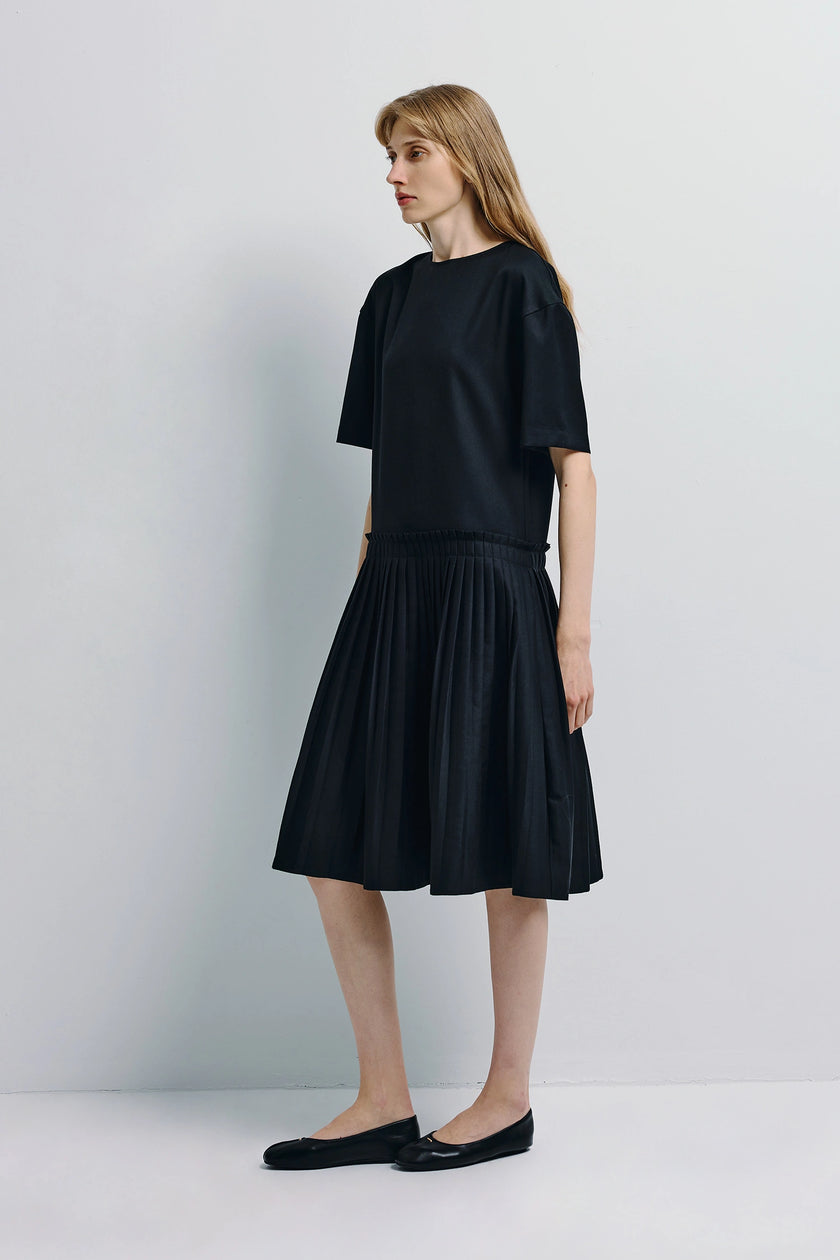 Lohan Pleated Skirt Dress in black with pleated skirt and shift silhouette, Rue Sophie