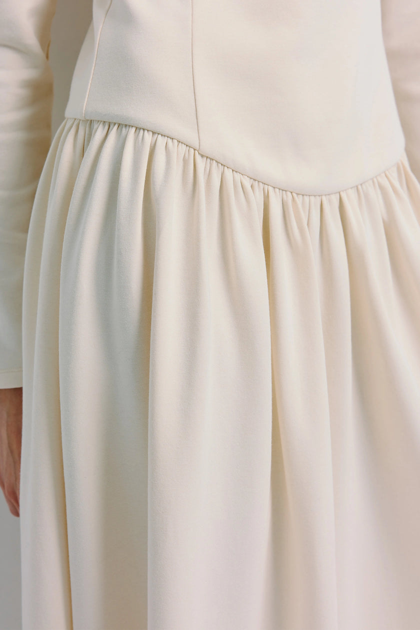 Lisette Boatneck Midi Dress cream, close-up detail showing fabric texture and design elements, modern elegance.