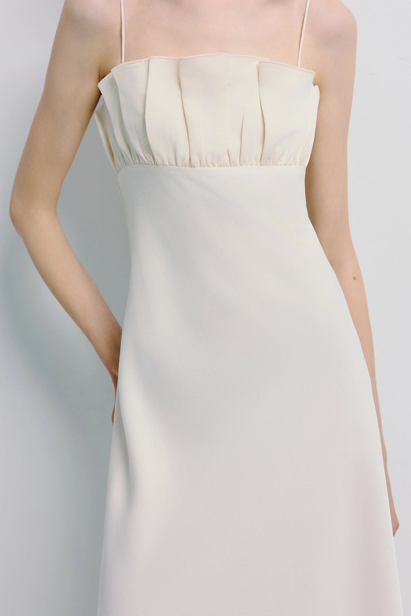 Rue Sophie Margaux Satin Midi Dress in Ivory. Shirred bodice, spaghetti straps, modern silhouette.