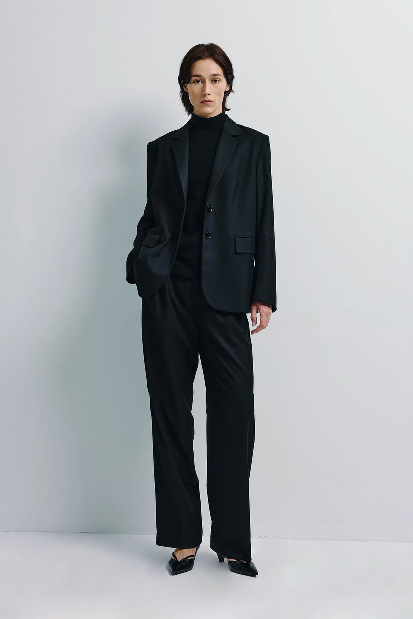 Black Neil Two-Button Blazer and trouser set on model, structured tailoring, minimalist style
