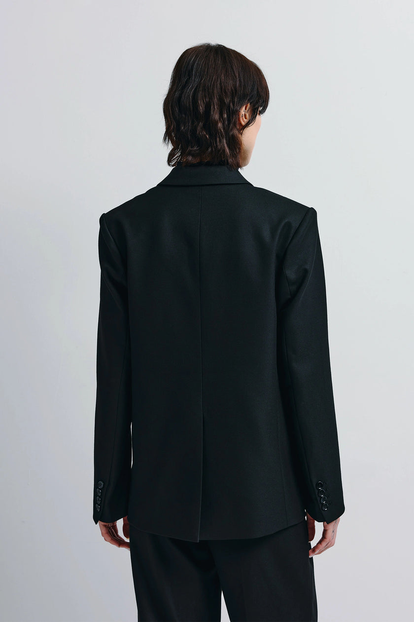 Black Neil Blazer, tailored back view. Single-breasted design and refined cut.