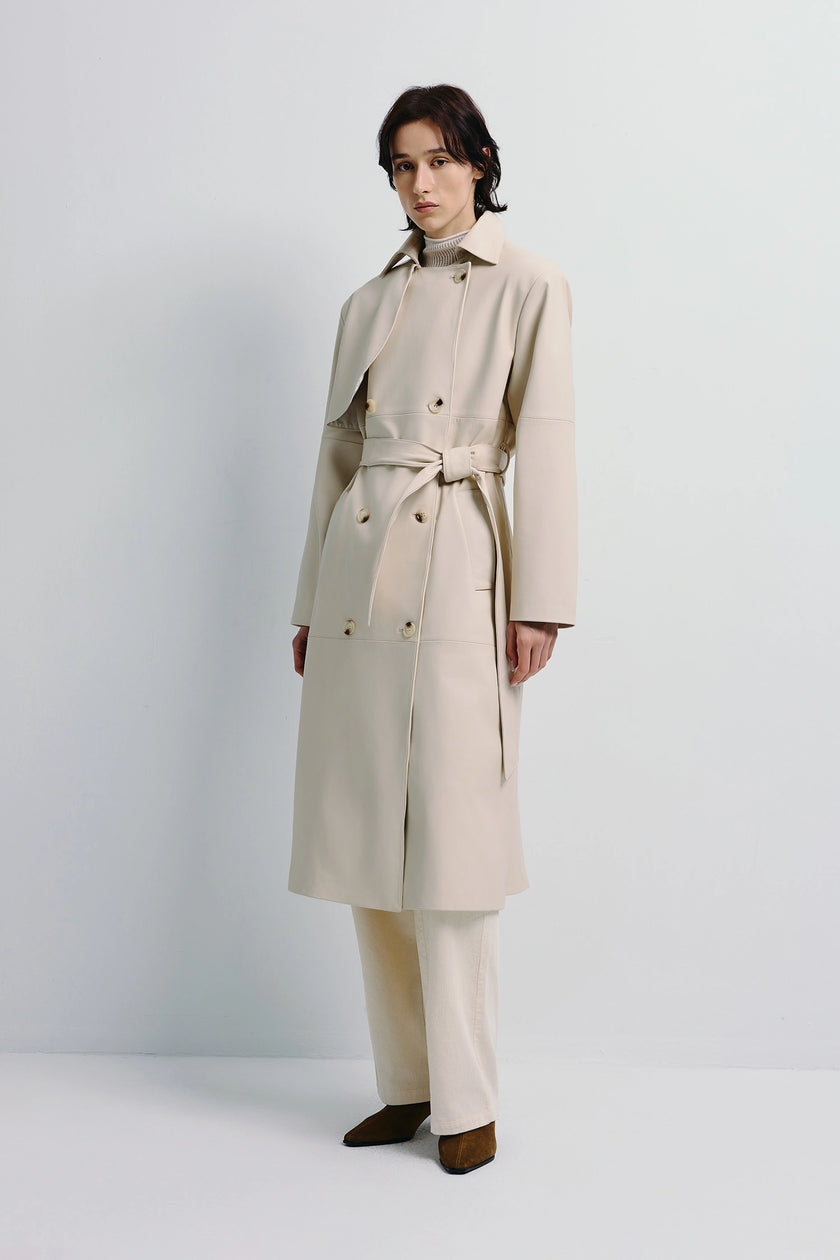 Cream Morsson Belted Leather Trench Coat on a model, oversized fit with belt detail and button closure
