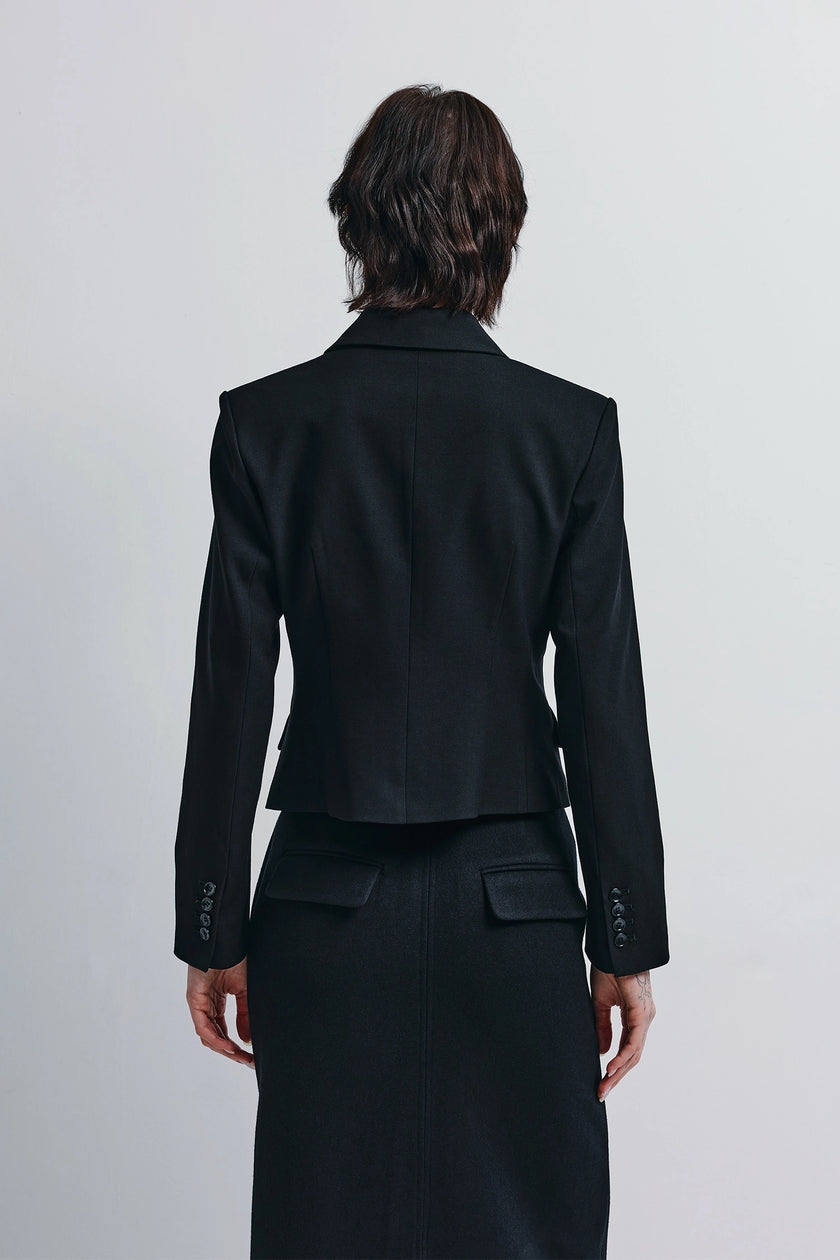 Black Lenn Fitted Short Blazer, back view showcasing tailored design and button cuffs, Rue Sophie