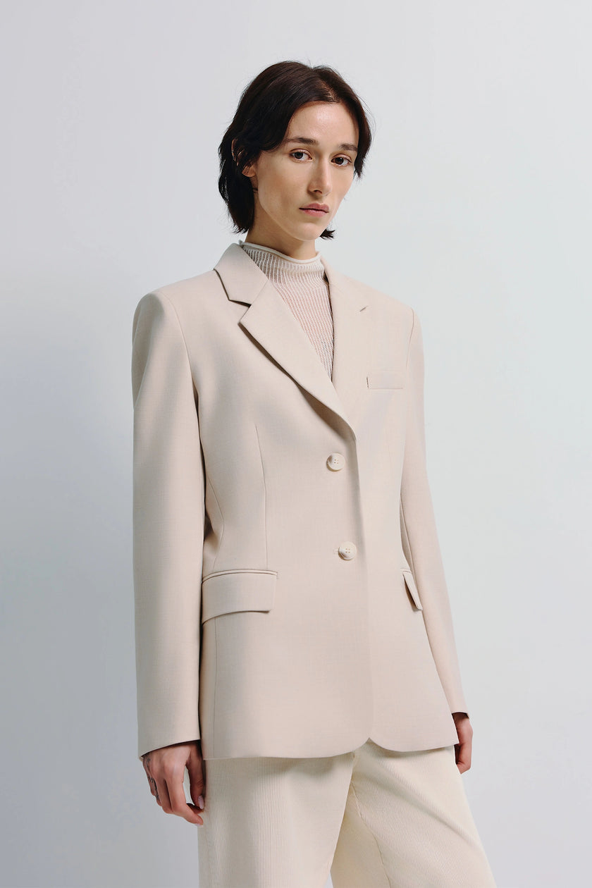 Light beige Ellison Oversized Shoulder Blazer with sculpted shoulders on a model