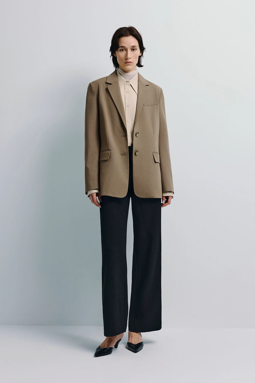 Walker Oversized Blazer in brown, paired with a light-colored shirt and black trousers