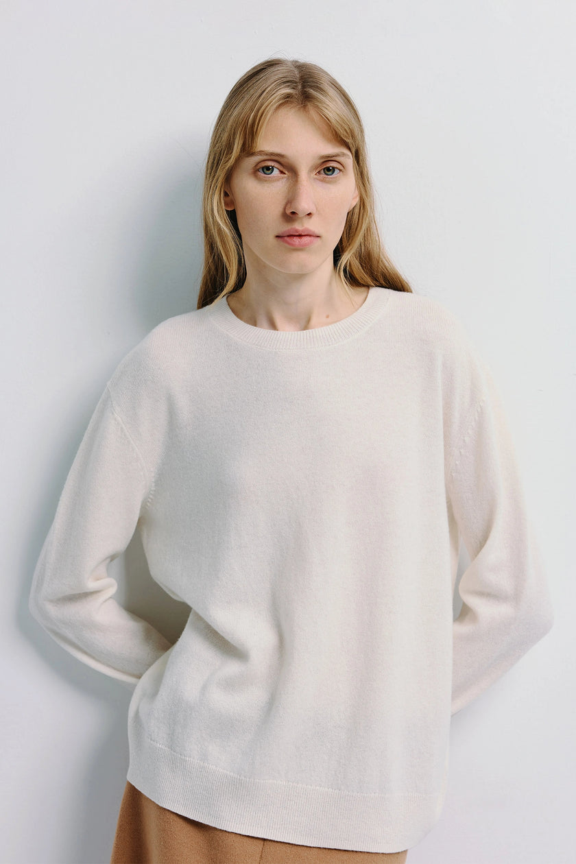Mia Crewneck Sweater in white, pure wool sweater, minimalist design, woman with long hair