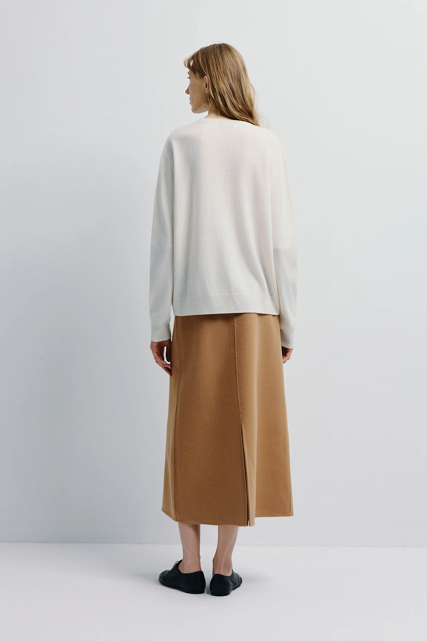 Mia Crewneck Sweater in white, paired with tan skirt and black shoes, minimalist design, Rue Sophie