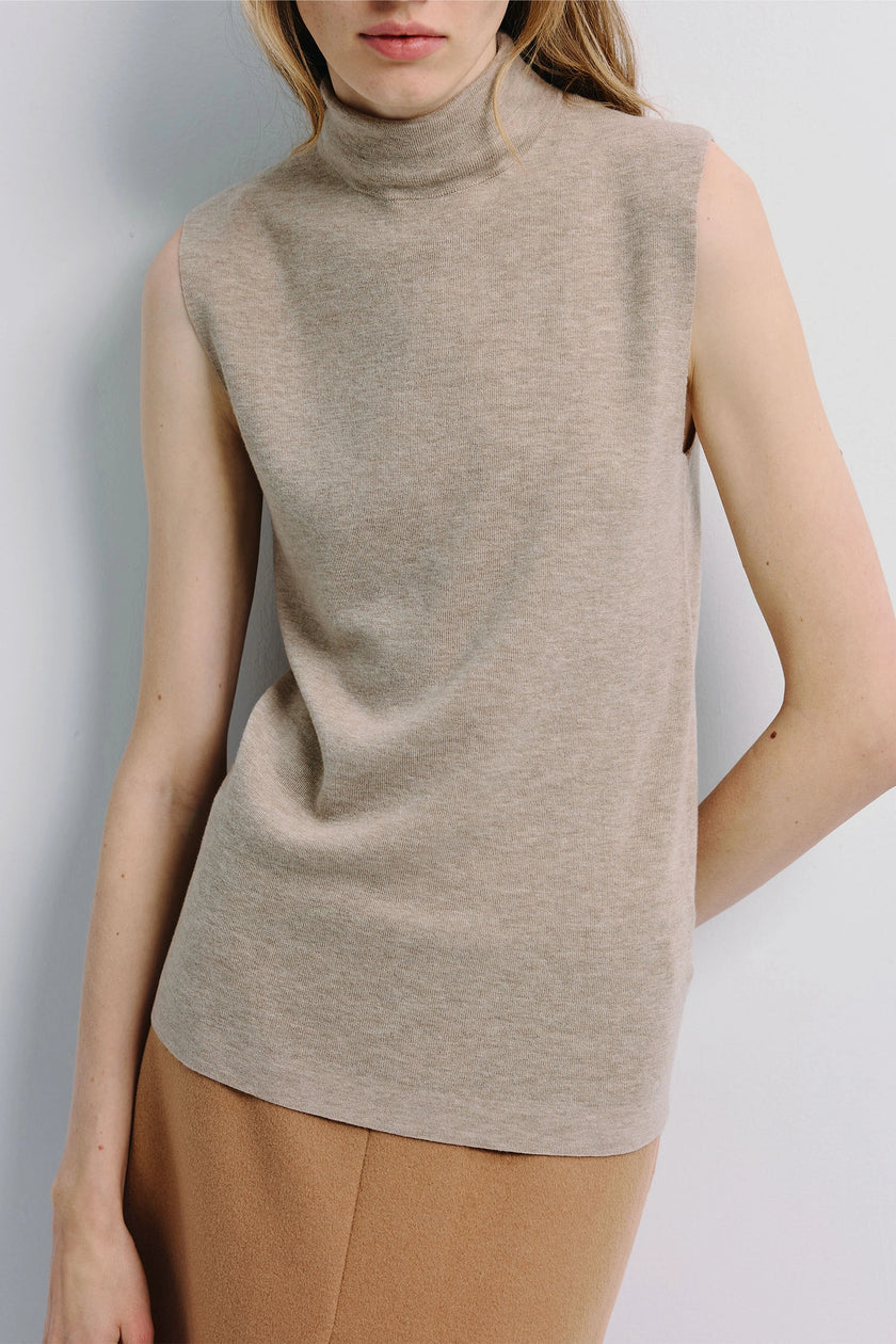 Lilou Sleeveless Turtleneck Top in beige wool knit, perfect for layering, a staple piece.