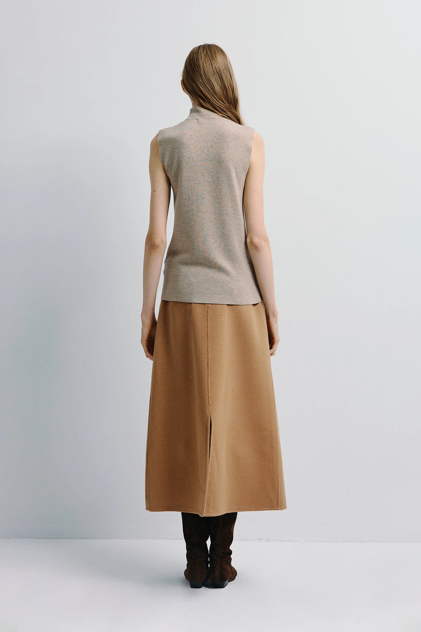 Lilou Sleeveless Turtleneck Top in beige, paired with camel skirt and boots, Rue Sophie minimalist design