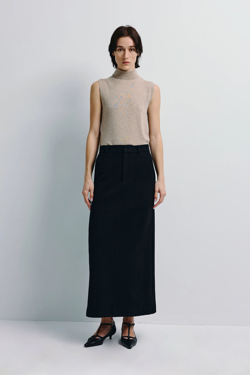 Lilou Sleeveless Turtleneck Top beige, with black long skirt. Rue Sophie's minimalist design.