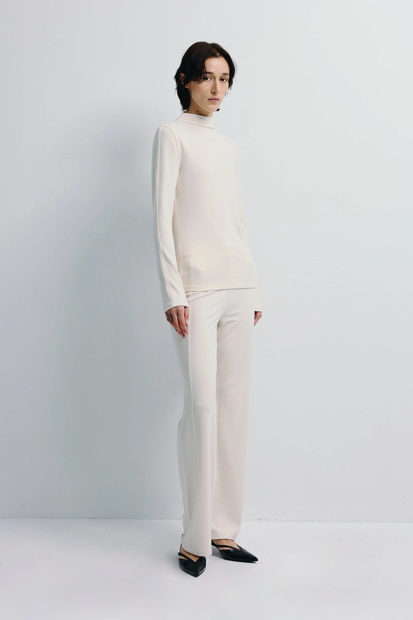 Cream Morgane High Neck Knit Top and matching pants. Soft-touch knit fabric. Modern style