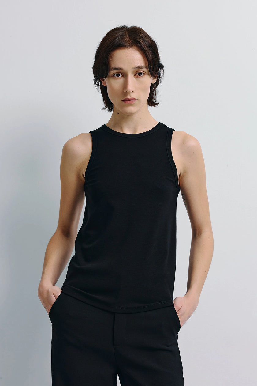 Béri High Neck Tank Top in black, soft wool-blend, featuring a sculpted neckline. Minimalist design for refined layering.