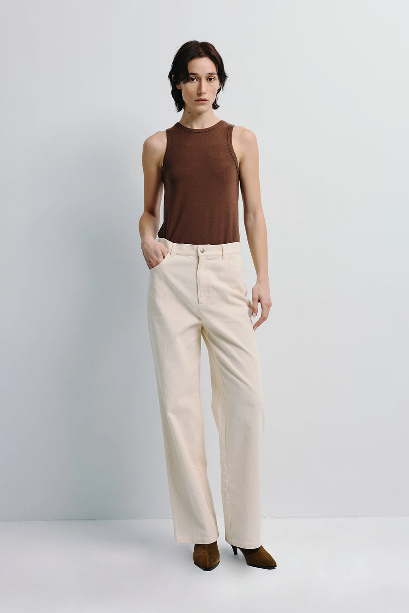 Béri High Neck Tank Top in brown stretch wool blend paired with cream pants