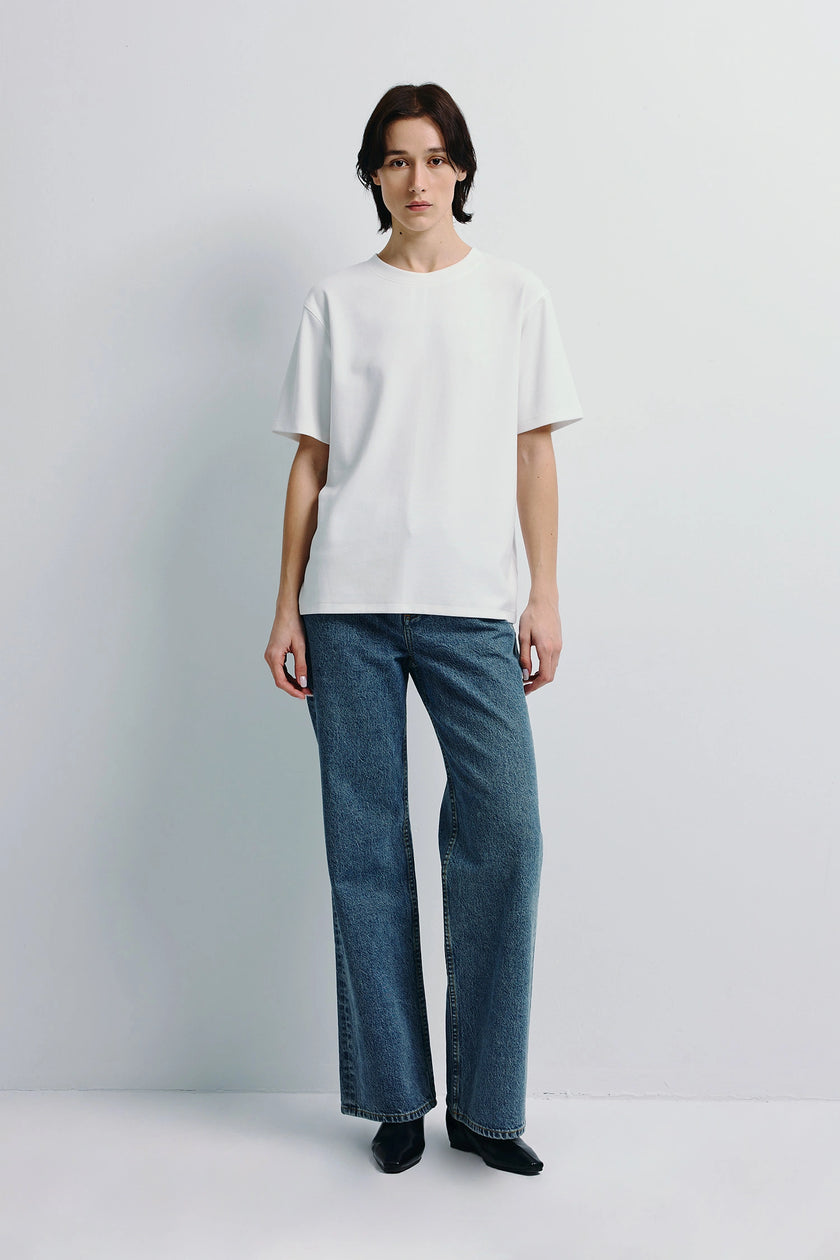 Owen Boxy Crewneck Tee in white, short-sleeved, boxy silhouette, with blue jeans, minimalist style