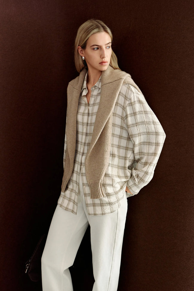 Three-quarter view of Rue Sophie’s Elouet Plaid Oversized Shirt in Ivory Plaid, highlighting the pointed collar, relaxed fit and oversized sleeves.