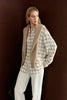 Three-quarter view of Rue Sophie’s Elouet Plaid Oversized Shirt in Ivory Plaid, highlighting the pointed collar, relaxed fit and oversized sleeves.