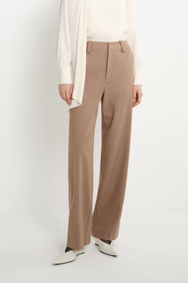 Close-up of Rue Sophie oak wide-leg trousers featuring a high waist, belt loops, concealed front closure, and tailored leg shape.