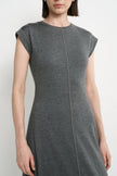 Close-up of the Rue Sophie Avi Out Stitched Dress in heather charcoal, highlighting the round neckline, cap sleeves, soft knit texture, and exposed center-front stitching.