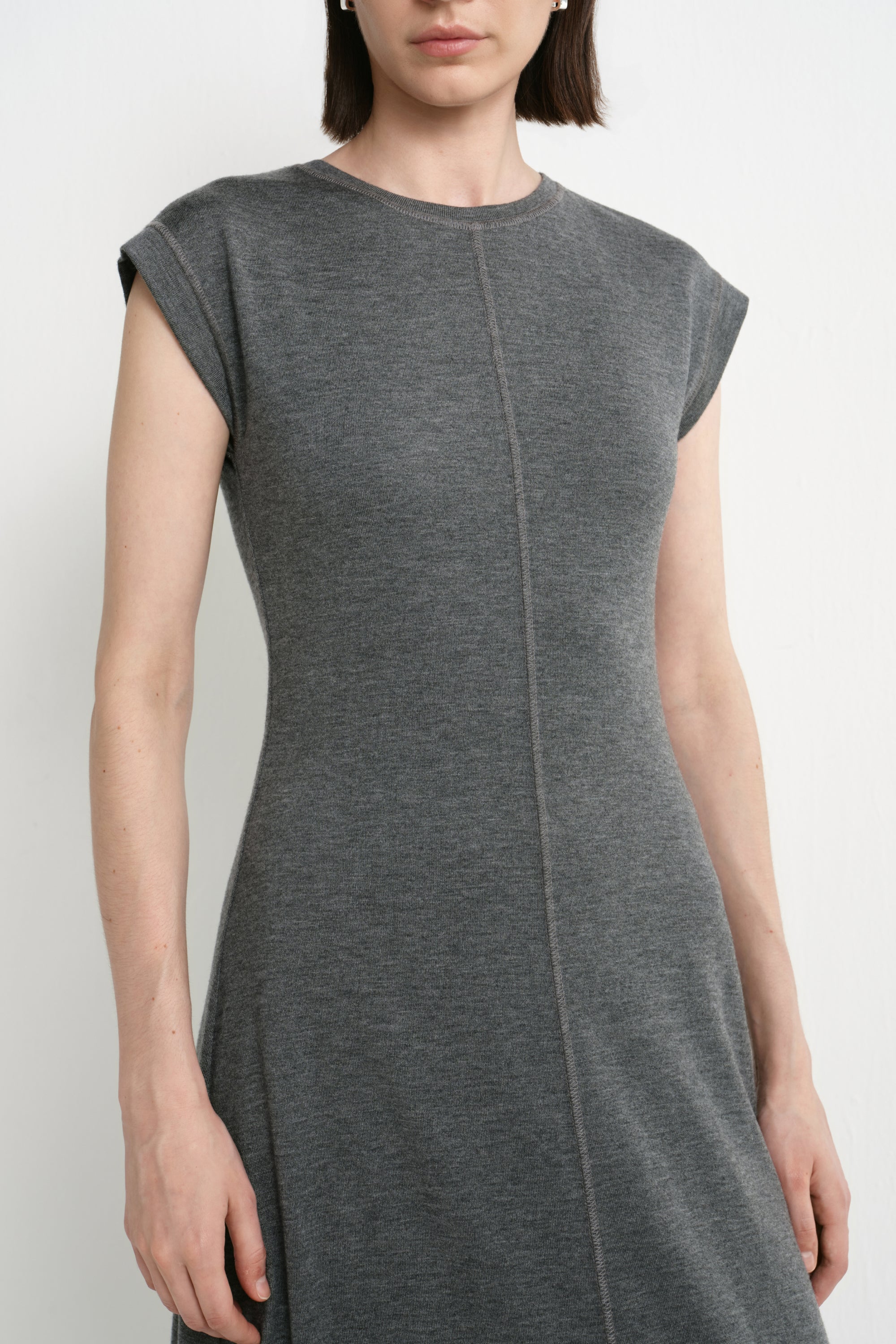 Close-up of the Rue Sophie Avi Out Stitched Dress in heather charcoal, highlighting the round neckline, cap sleeves, soft knit texture, and exposed center-front stitching.