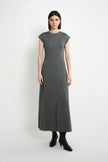 A model wearing the Rue Sophie Avi Out Stitched Dress in heather charcoal, featuring cap sleeves, exposed center-front stitching, and a long A-line silhouette, front view.