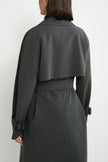Close-up of the Rue Sophie Gavin Trench Coat in H. Charcoal, highlighting the oversized lapel, double-breasted buttons, shoulder construction, and belted waist detail.